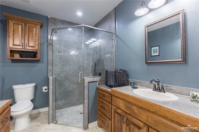 bathroom with vanity, toilet, and walk in shower