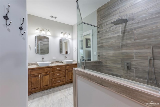 bathroom with vanity and an enclosed shower