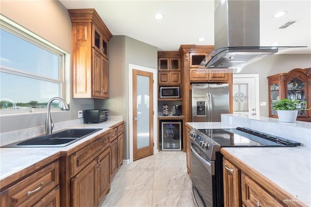 kitchen featuring island range hood, beverage cooler, sink, and appliances with stainless steel finishes