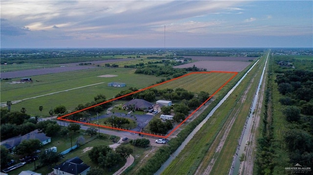 birds eye view of property with a rural view