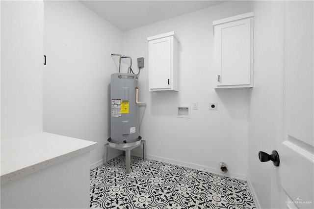 washroom featuring electric water heater, washer hookup, electric dryer hookup, and cabinets