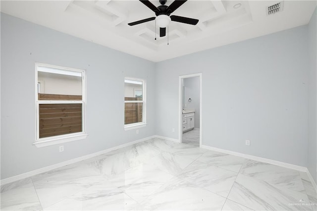 unfurnished bedroom featuring ceiling fan, ensuite bathroom, and coffered ceiling