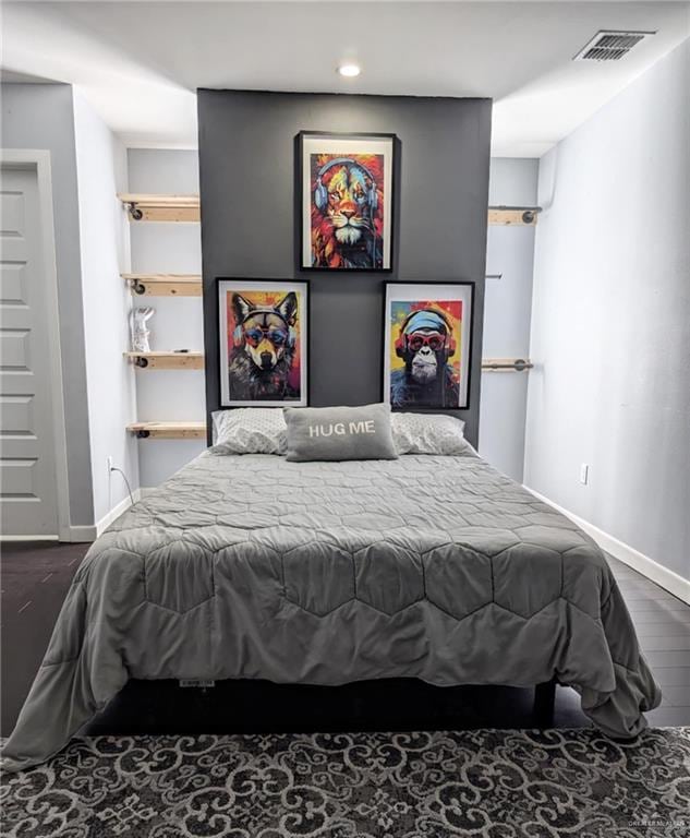 bedroom featuring dark hardwood / wood-style floors