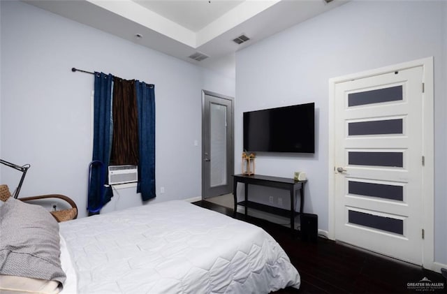 bedroom featuring dark hardwood / wood-style flooring