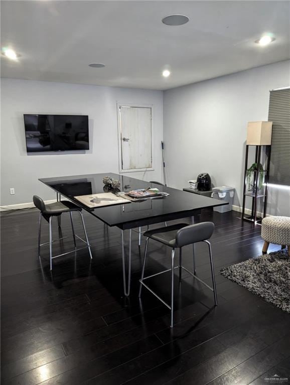 dining area with dark wood-type flooring