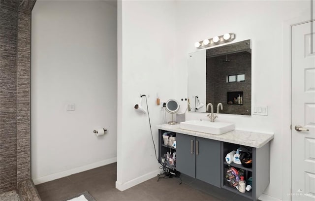 bathroom featuring tile patterned floors, vanity, and walk in shower