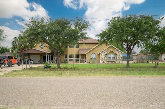 view of front of home featuring a front yard and a fenced front yard