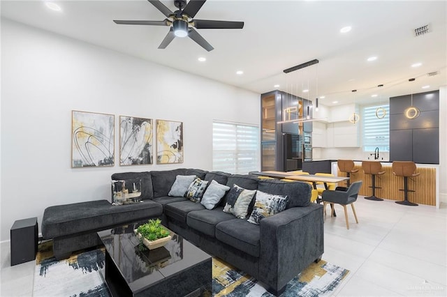 701 Santa Cecilia St, Donna, TX 78537 - living room featuring light tile patterned flooring, a ceiling fan, and recessed lighting