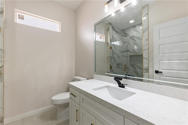 bathroom featuring an enclosed shower, vanity, and toilet