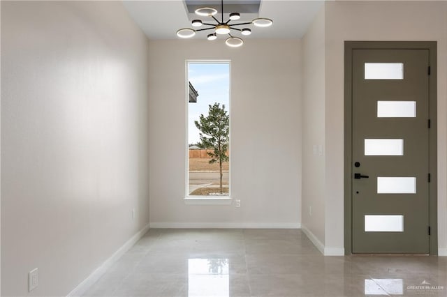 entrance foyer featuring a notable chandelier