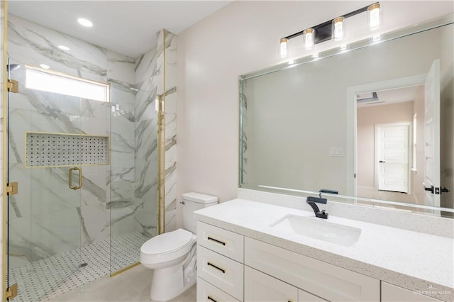 bathroom with vanity, toilet, and an enclosed shower