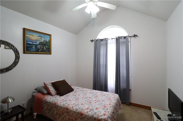 bedroom featuring ceiling fan, carpet, baseboards, and vaulted ceiling