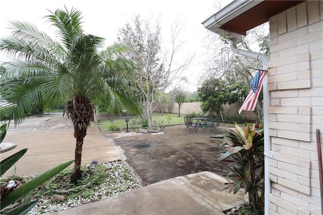 view of patio with outdoor dining space and a fenced backyard