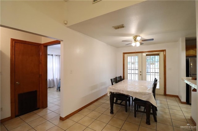 dining area with light tile patterned floors, french doors, visible vents, and baseboards