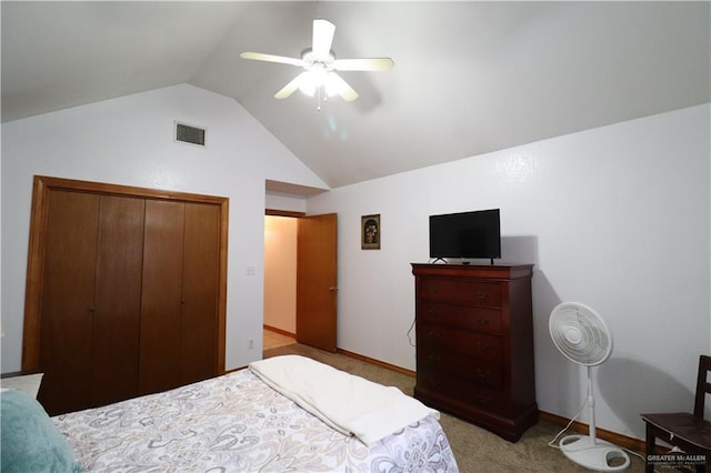 bedroom with light carpet, visible vents, ceiling fan, vaulted ceiling, and a closet