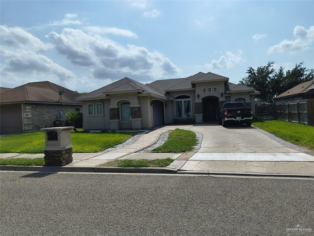 3727 Bianca St, Edinburg, TX 78539 - mediterranean / spanish house featuring concrete driveway, an attached garage, and stucco siding