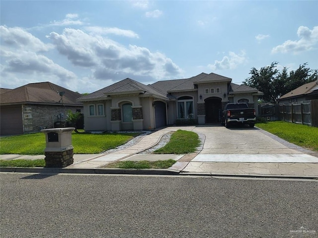 3727 Bianca St, Edinburg, TX 78539 - mediterranean / spanish house featuring concrete driveway, an attached garage, and stucco siding