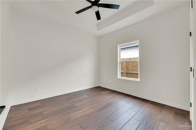 empty room featuring hardwood / wood-style flooring and ceiling fan