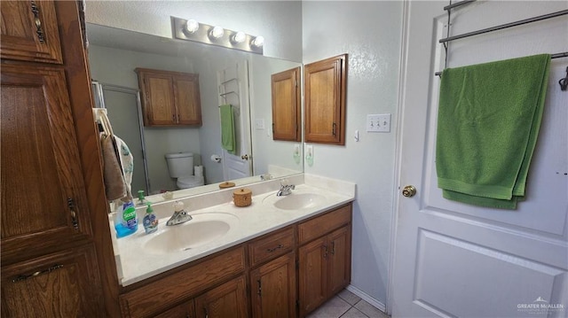 2434 Starling Cir E, Palmview, TX 78572 - bathroom featuring double vanity, a sink, an enclosed shower, and toilet