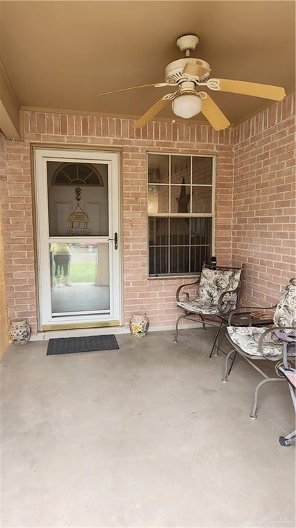 2434 Starling Cir E, Palmview, TX 78572 - property entrance with brick siding and a ceiling fan