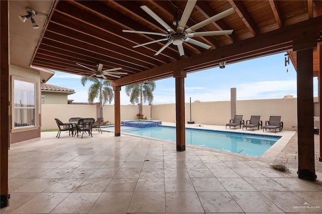 view of swimming pool with an in ground hot tub and a patio area