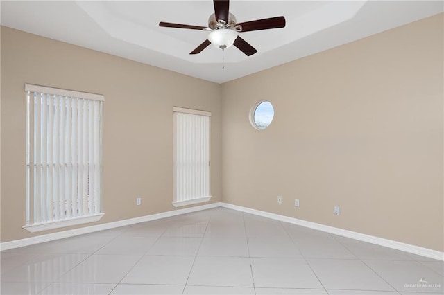 unfurnished room featuring ceiling fan and light tile patterned floors