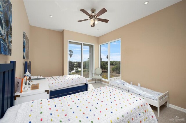 bedroom with ceiling fan and carpet floors