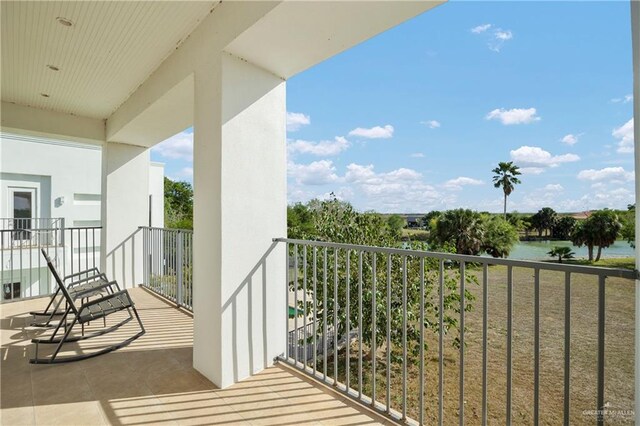 balcony featuring a water view