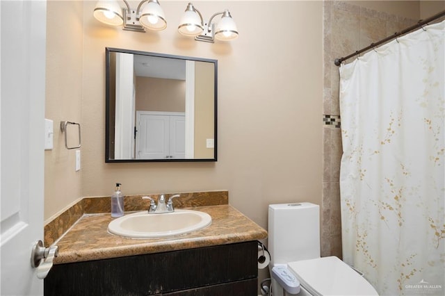 bathroom featuring vanity, toilet, and curtained shower