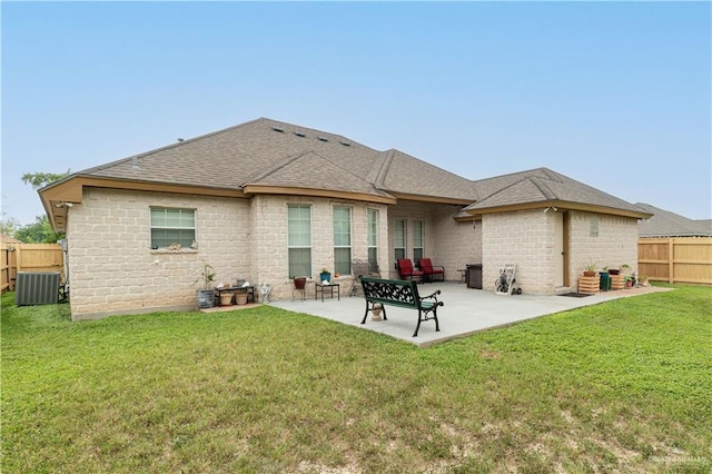 1014 Emerald Dr, Weslaco, TX 78599 - back of property featuring a patio, roof with shingles, and cooling unit