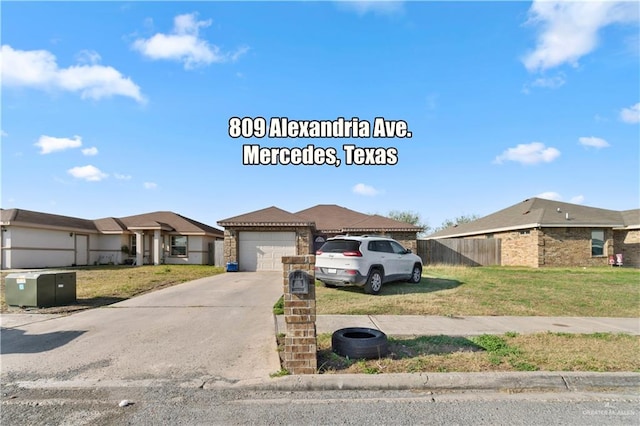 view of front facade with a garage and a front lawn