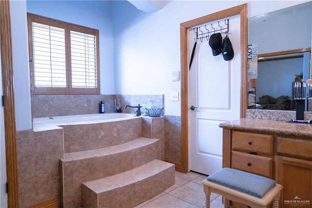 bathroom featuring tile patterned flooring and tiled tub