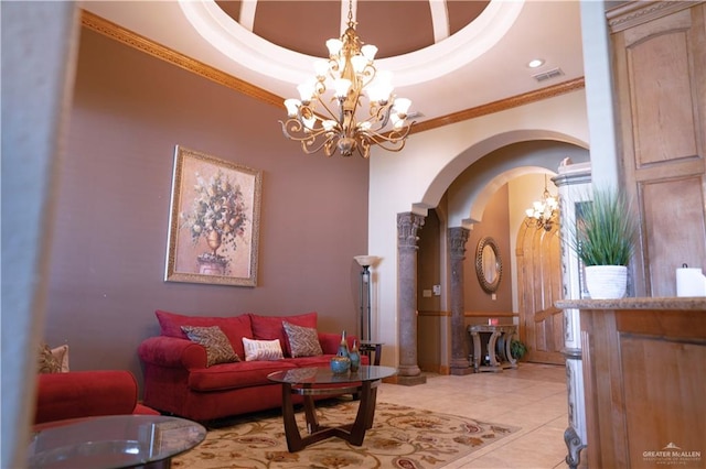 living room with light tile patterned flooring, ornamental molding, and an inviting chandelier