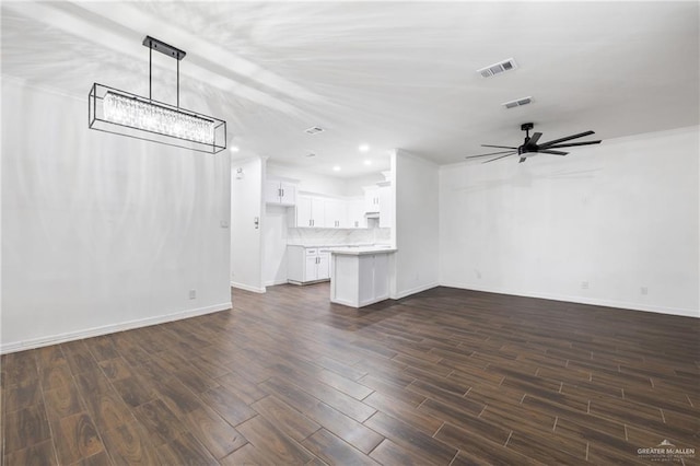 unfurnished living room with ceiling fan