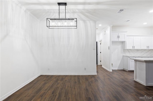 unfurnished dining area featuring dark hardwood / wood-style floors