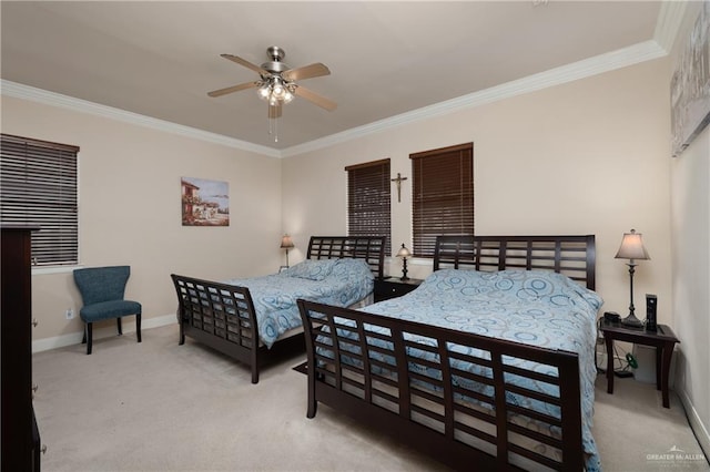 carpeted bedroom with ceiling fan and ornamental molding