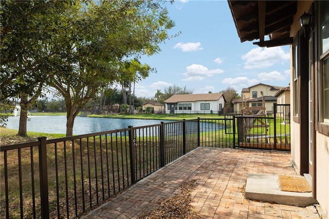 view of patio with a water view