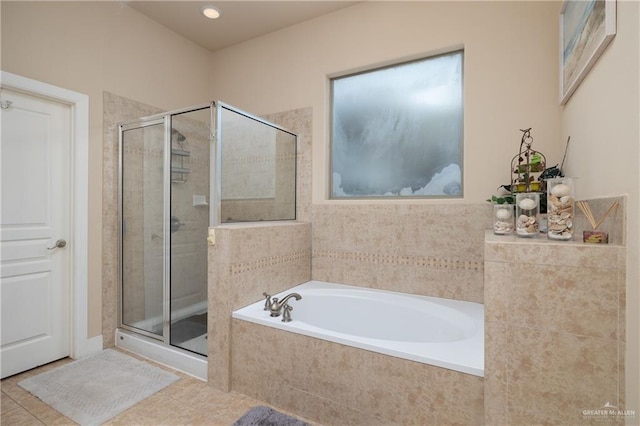 bathroom featuring separate shower and tub and tile patterned floors