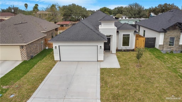 view of front of home with a garage, concrete driveway, roof with shingles, a front yard, and stucco siding