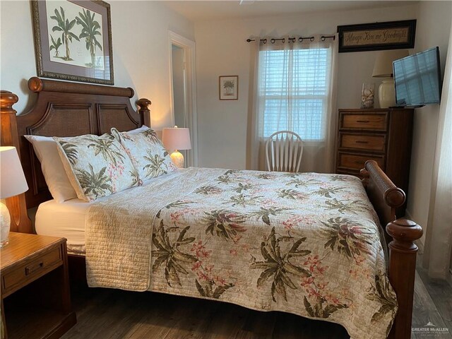 bedroom featuring dark wood-type flooring