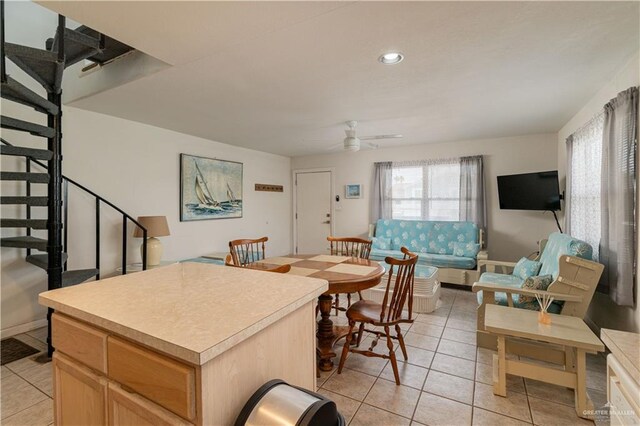 dining room with ceiling fan and light tile patterned floors