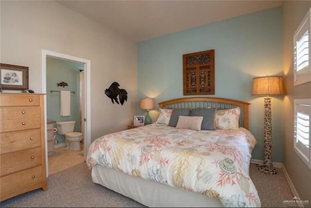 bedroom with carpet and ensuite bath