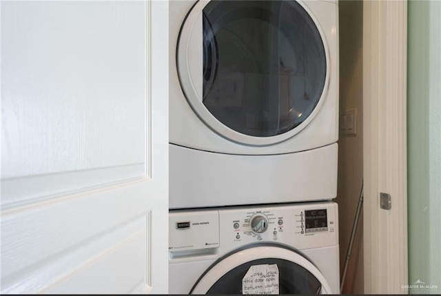 laundry area with stacked washer / drying machine