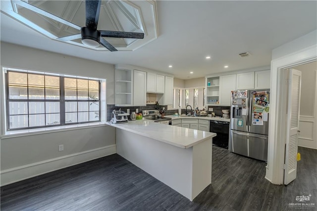 kitchen featuring ceiling fan, white cabinetry, kitchen peninsula, and appliances with stainless steel finishes