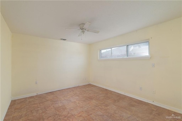 empty room featuring ceiling fan