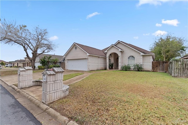 ranch-style home with a front yard and a garage