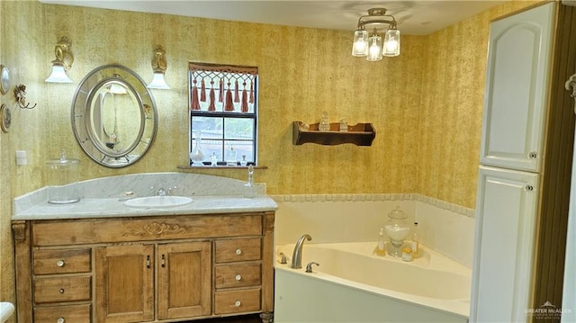 bathroom with a bath and vanity