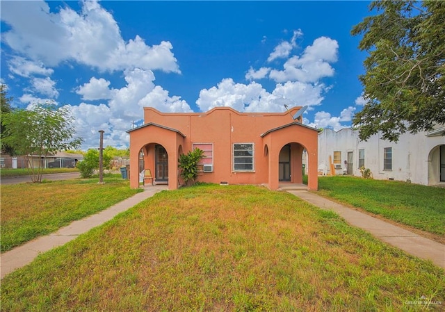 view of front of home with a front yard