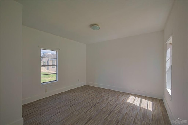 empty room featuring dark hardwood / wood-style flooring