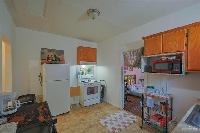 kitchen with white appliances and sink